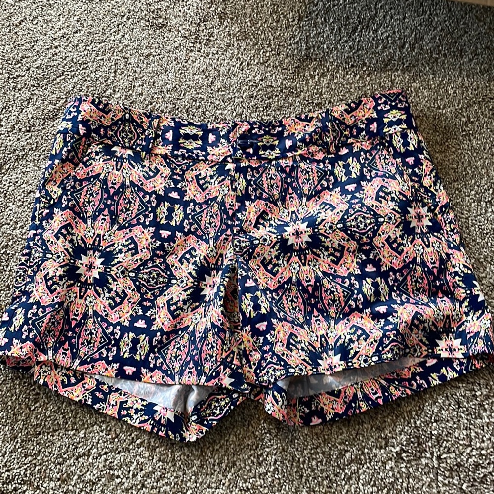 Hot pink and navy print shorts.